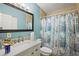 Bathroom featuring a vanity, toilet, shower, and nautical-themed shower curtain at 1508 Roger Babson Rd, Orlando, FL 32808