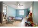 Bedroom with tiled floor, ceiling fan, window, bed, and furniture at 1508 Roger Babson Rd, Orlando, FL 32808