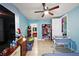 Bedroom featuring a ceiling fan, furnishings, and an open closet at 1508 Roger Babson Rd, Orlando, FL 32808