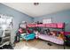 Bedroom featuring bunk beds and a window with sheer curtain at 1508 Roger Babson Rd, Orlando, FL 32808