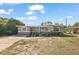 Charming single-story home featuring a cozy front porch and a well-maintained lawn with large driveway at 1508 Roger Babson Rd, Orlando, FL 32808