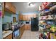 Functional kitchen with appliances, sink, cabinets, and pantry at 1508 Roger Babson Rd, Orlando, FL 32808