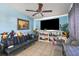 Inviting living space featuring tile flooring, a ceiling fan, and comfortable seating at 1508 Roger Babson Rd, Orlando, FL 32808