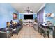 Cozy living room with tile flooring, a ceiling fan, and blue walls at 1508 Roger Babson Rd, Orlando, FL 32808
