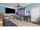 Bright living room with tile floors, contemporary furniture, and natural light at 1508 Roger Babson Rd, Orlando, FL 32808