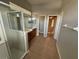 Bathroom featuring double vanity, shower, and tiled floor creating functionality and style at 151 Prestwick Dr, Davenport, FL 33897