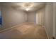 Comfortable bedroom with carpet flooring, neutral paint, and a window providing natural light at 151 Prestwick Dr, Davenport, FL 33897