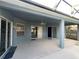 Covered patio with ceiling fan, sliding doors offering comfortable outdoor living space at 151 Prestwick Dr, Davenport, FL 33897
