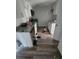 A kitchen featuring granite countertops, white cabinetry, and stainless steel appliances at 1620 Grand St, Orlando, FL 32805