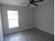 Bedroom featuring wood-look flooring, ceiling fan, and natural light at 16648 Sw 25Th Ct, Ocala, FL 34473