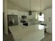 Bright, eat-in kitchen featuring white cabinets, stainless steel appliances, and pantry at 16648 Sw 25Th Ct, Ocala, FL 34473