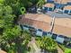 Aerial view of the townhouse with lush landscaping, offering a serene and inviting residential setting at 170 Lago Vista Blvd, Casselberry, FL 32707
