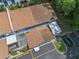 Aerial view highlighting the townhouse roof, parking area, and surrounding landscape, showcasing the property's location at 170 Lago Vista Blvd, Casselberry, FL 32707