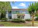 Inviting townhouse with a well-maintained lawn and blue and white exteriors, providing a cozy and appealing curb presence at 170 Lago Vista Blvd, Casselberry, FL 32707