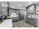 Bright kitchen featuring gray cabinets, stainless steel appliances, white subway tile and quartz countertops at 170 Lago Vista Blvd, Casselberry, FL 32707