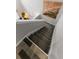 Carpeted stairs leading to a well lit room with tiled floors at 170 Lago Vista Blvd, Casselberry, FL 32707