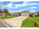 Charming single-story home with patterned driveway, lush lawn, and inviting curb appeal at 17567 Se 81St Parnassus Ct, The Villages, FL 32162