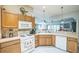 Functional kitchen with ample counter space and an open view to the living area at 17567 Se 81St Parnassus Ct, The Villages, FL 32162