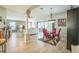 Open-concept living room featuring abundant natural light and a modern dining area at 17567 Se 81St Parnassus Ct, The Villages, FL 32162