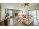 Comfortable living area with ample seating and sliding glass doors to the outdoors at 17567 Se 81St Parnassus Ct, The Villages, FL 32162