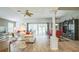 Bright living space showcasing a ceiling fan and seamless flow to the dining area at 17567 Se 81St Parnassus Ct, The Villages, FL 32162