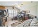 Functional office space with built-in shelving, natural light, and comfortable seating at 17567 Se 81St Parnassus Ct, The Villages, FL 32162