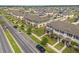 Aerial view of community featuring townhomes with sidewalks and street trees at 1797 Red Canyon Dr, Kissimmee, FL 34744