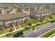 Aerial view of community featuring townhomes with sidewalks and street trees at 1797 Red Canyon Dr, Kissimmee, FL 34744