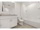 Bright bathroom featuring a shower-tub combo and a single sink vanity with a large mirror at 1797 Red Canyon Dr, Kissimmee, FL 34744