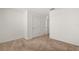 Neutral bedroom with carpet flooring, a window, and a white door at 1797 Red Canyon Dr, Kissimmee, FL 34744