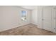 Cozy bedroom with plush carpet, a window with blinds, and a white door at 1797 Red Canyon Dr, Kissimmee, FL 34744