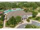 Aerial view of clubhouse with pool, lounge chairs, and sidewalks at 1797 Red Canyon Dr, Kissimmee, FL 34744