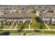 New construction townhomes with covered entryways and small lawns at 1797 Red Canyon Dr, Kissimmee, FL 34744