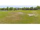 Aerial view of grassy field with soccer goal and neighborhood in background at 1797 Red Canyon Dr, Kissimmee, FL 34744