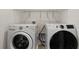Well-lit laundry room featuring a washing machine and dryer at 1797 Red Canyon Dr, Kissimmee, FL 34744