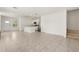 Open-concept living space with tile floors, white walls, and stainless steel appliances at 1797 Red Canyon Dr, Kissimmee, FL 34744