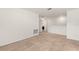 An open loft area with carpet and a washer and dryer in the background at 1797 Red Canyon Dr, Kissimmee, FL 34744