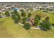 Aerial view of community playground with green spaces and sidewalks at 1797 Red Canyon Dr, Kissimmee, FL 34744