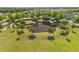 Aerial view of community playground with shaded picnic tables and swing sets at 1797 Red Canyon Dr, Kissimmee, FL 34744