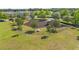 Aerial view of community playground with shaded picnic tables and swing sets at 1797 Red Canyon Dr, Kissimmee, FL 34744