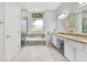 A serene bathroom featuring a soaking tub, glass shower, and granite countertops at 1837 Sweetwater West Cir, Apopka, FL 32712