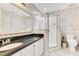 Bathroom featuring a frameless shower with glass doors, a sleek vanity, and modern fixtures, providing a spa-like feel at 1837 Sweetwater West Cir, Apopka, FL 32712