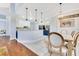 Bright dining area with hardwood floors and open layout to kitchen at 1837 Sweetwater West Cir, Apopka, FL 32712