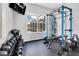 Bright exercise room with professional weights and a full weight rack equipment set at 1837 Sweetwater West Cir, Apopka, FL 32712