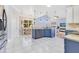 Open kitchen featuring navy cabinets, granite counters, and an island at 1837 Sweetwater West Cir, Apopka, FL 32712