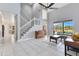 Bright and airy living room with high ceilings and open access to the pool area through sliding glass doors at 1837 Sweetwater West Cir, Apopka, FL 32712