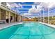 Relaxing screened-in pool and patio area perfect for outdoor enjoyment at 1837 Sweetwater West Cir, Apopka, FL 32712