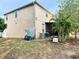 Home exterior showing a spacious yard with back patio area and mechanical systems at 211 Hunt St, Clermont, FL 34711
