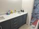 Bathroom features a dual sink vanity with sleek cabinetry and marble countertops at 211 Hunt St, Clermont, FL 34711