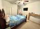 Cozy bedroom featuring a queen-sized bed, ceiling fan, and closet at 211 Hunt St, Clermont, FL 34711